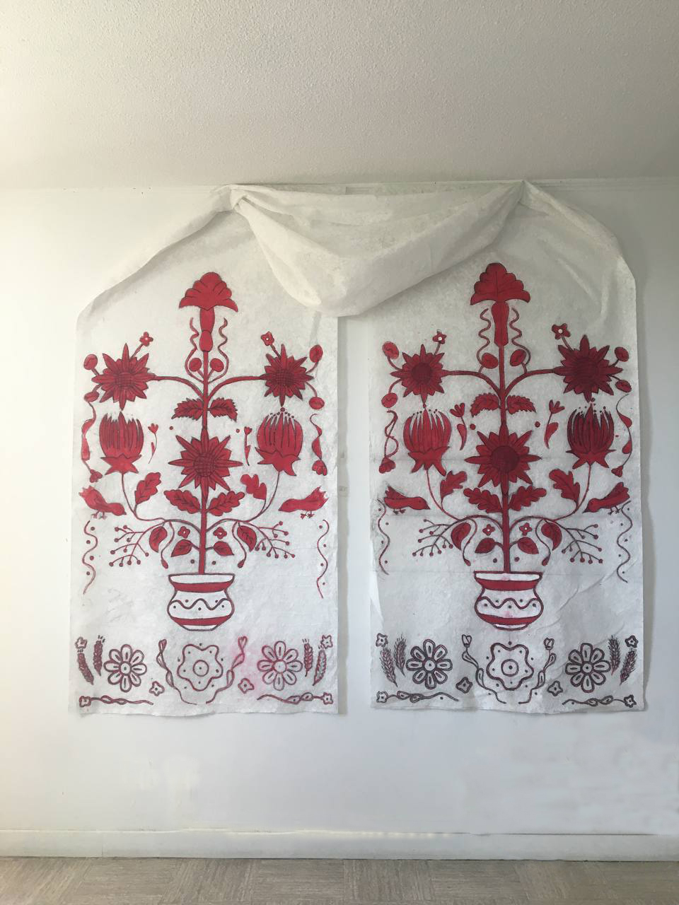 Tree of Life - two fabric panels painted with red Ukrainian folk motifs of flowering trees in vases